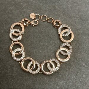 Absolute rose gold tone circular interlocking chain-link rhinestone bracelet